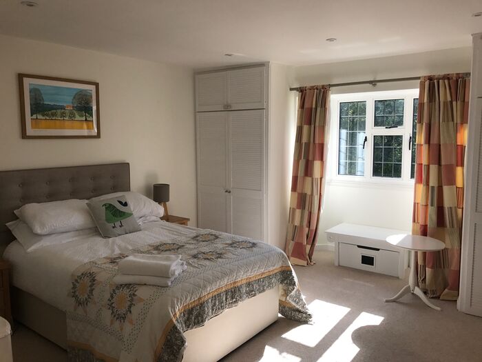 Double bedroom with a garden-view window