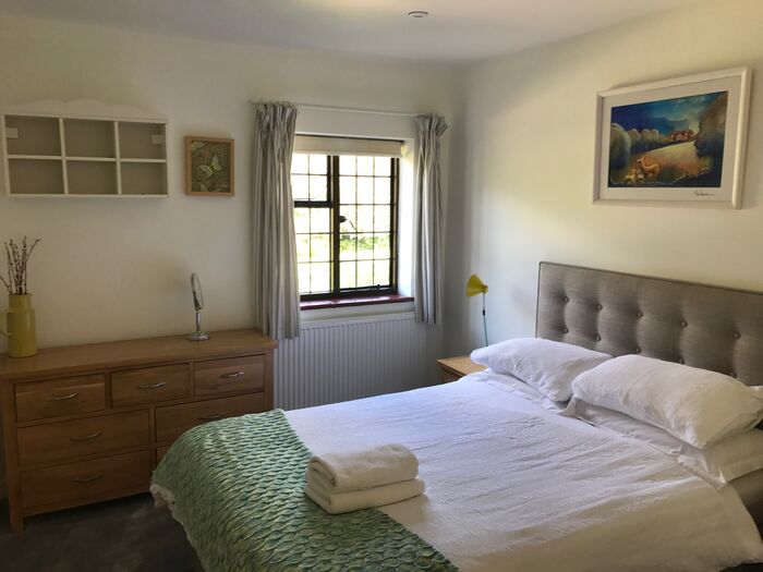 Double bedroom with an upholstered headboard