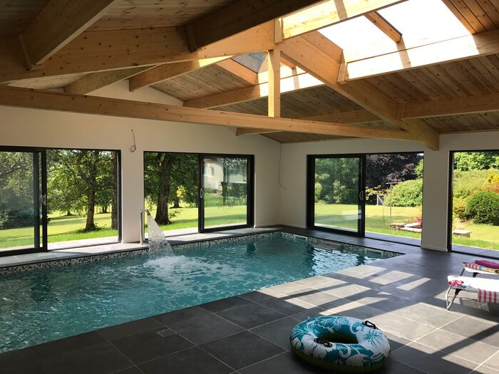 Indoor swimming pool opening onto the gardens