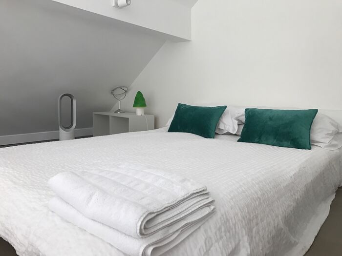 Double bedroom with teal accents