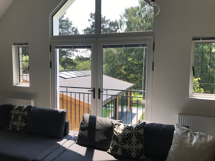 Upstairs seating area with balcony doors