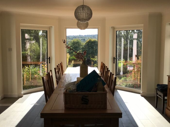 Dining room with a large table and garden views